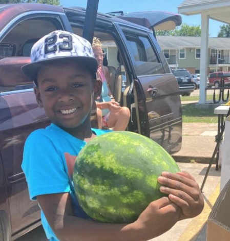 boy holding watermelon